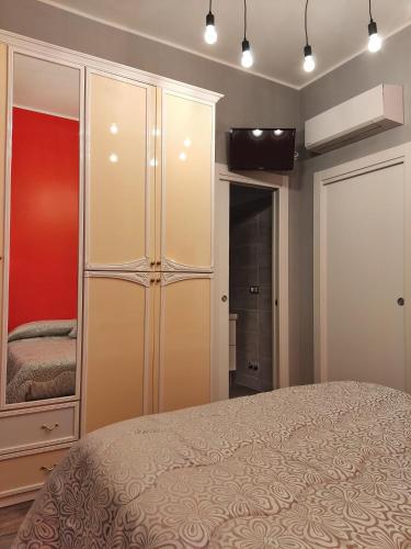 a bedroom with a bed and a closet at The Junior House - Casa Vacanza in Lauria