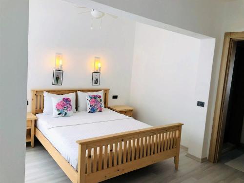 Кровать или кровати в номере Datça Gül Apart