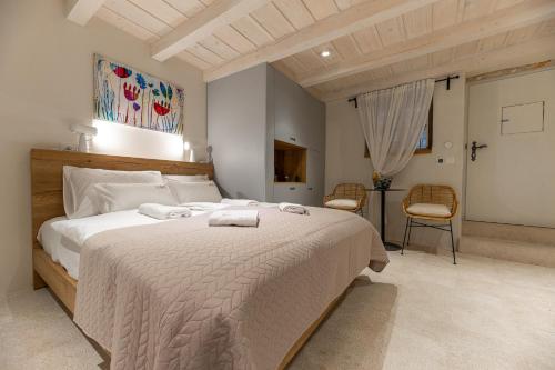 a bedroom with a large bed with two towels on it at Superior Room Gabriela in Dubrovnik