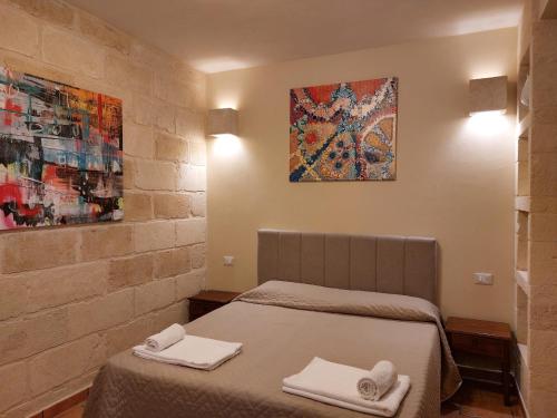 Ένα ή περισσότερα κρεβάτια σε δωμάτιο στο Villa Rosa Candida