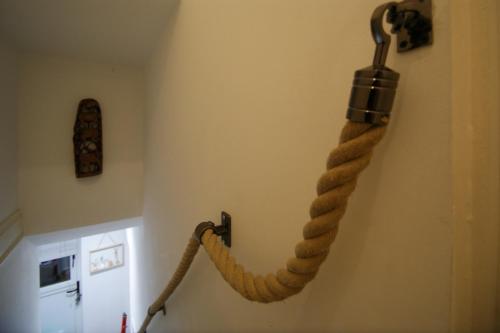 a rope hanging on the wall of a room at Bank View next to the Fleece Countryside Inn in Barkisland