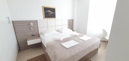 Postel nebo postele na pokoji v ubytování Apartments Lofiel