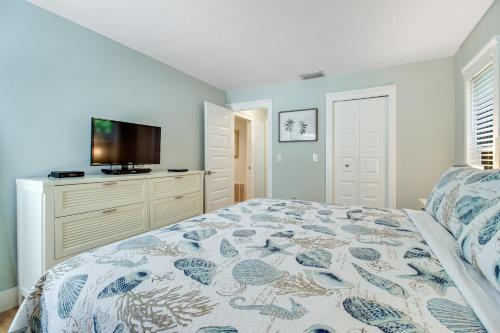 a bedroom with a bed and a flat screen tv at Almost There in Bradenton