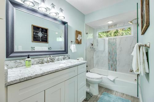 a bathroom with a sink and a toilet and a shower at Almost There in Bradenton