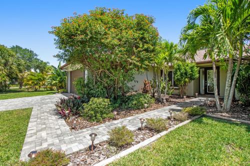 a house with a garden in front of it at Almost There in Bradenton