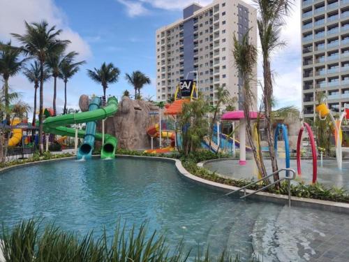 a water park with a slide in the water at Salinas Premium Resort in Salinópolis