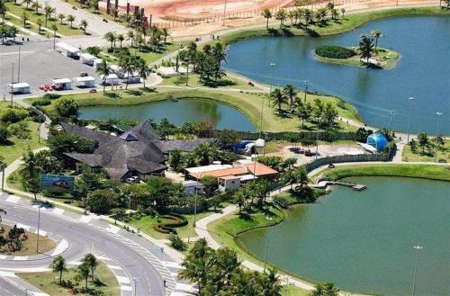 an aerial view of a resort with a large lake at Vi&Li Suites in Aracaju