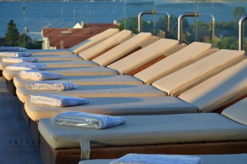 a row of seats sitting on top of a building at Ferush Boutique Hotel in Urla
