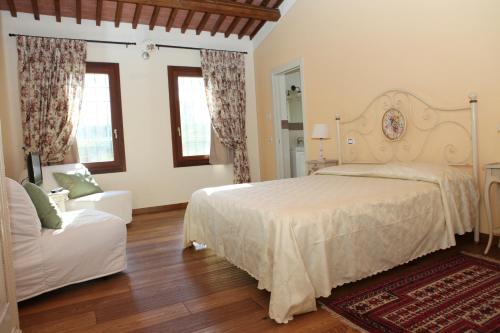 Postel nebo postele na pokoji v ubytování B&B "Corte San Tomaso"