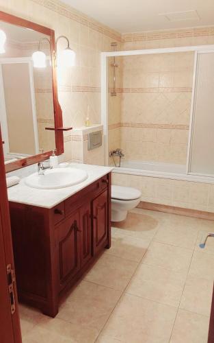 a bathroom with a sink and a toilet at GRANI MAR in Costa Calma