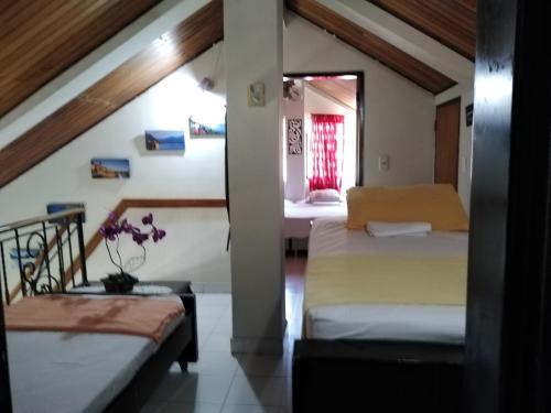 Ένα ή περισσότερα κρεβάτια σε δωμάτιο στο Hellen House playa habitación familiar de dos a 4 pax