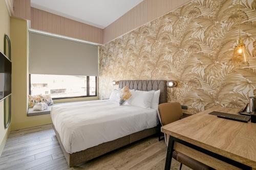 Postel nebo postele na pokoji v ubytování 森行旅 Mori Hotel -台南安平老街
