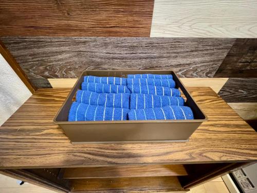 a tray of blue bottles sitting on a table at Kominka Okinawa in Okinawa City