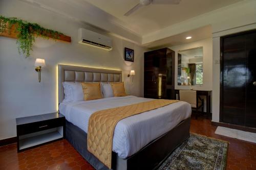 a bedroom with a large bed in a room at Elite Hotel in Lonavala