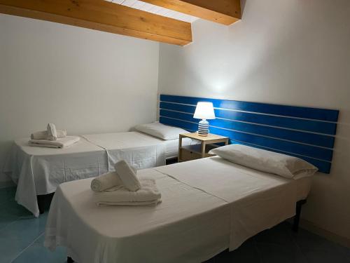 Postel nebo postele na pokoji v ubytování Rada Delle Tortore