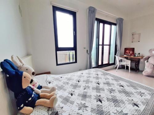 Postel nebo postele na pokoji v ubytování Luodong Little Stay