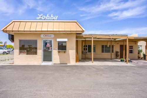 a coffee shop with a sign on top of it at OYO Hotel Yuma AZ - I-8 US-95 in Yuma