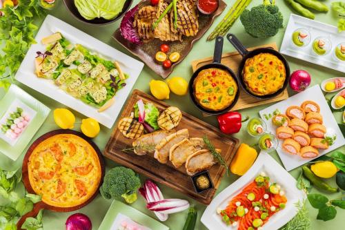 a table topped with lots of different types of food at ANA Crowne Plaza Akita by IHG in Akita