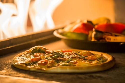 a small pizza sitting on top of a table at ANA Crowne Plaza Akita by IHG in Akita