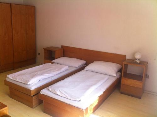 Кровать или кровати в номере Hotel Bělohlávek