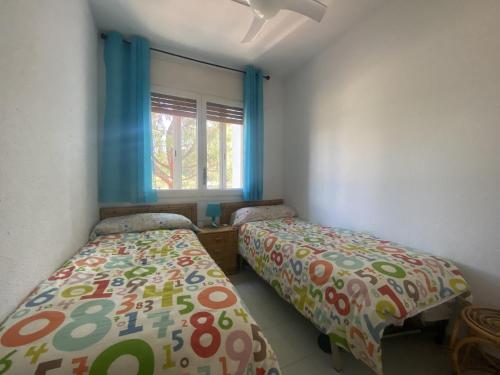A bed or beds in a room at R121 - Apartamento Alorda park
