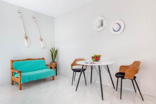 a dining room with a table and chairs at Elena-Stella Apartments Arillas Corfu in Arillas