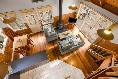 an overhead view of a living room with a stove at Lorne Bush House Cottages & Eco Retreats in Lorne