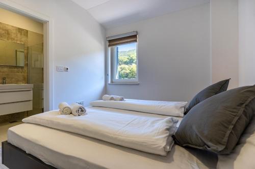 מיטה או מיטות בחדר ב-SUNRISE ISLAND LOFT