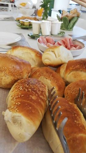 a bunch of buns with a fork on a table at Etna Casa del Sole in Nicolosi