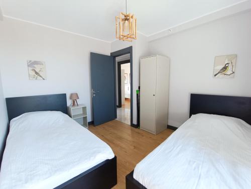 Cama o camas de una habitación en Luxury Fully Equipped 3BR 2BA Apartment by Siena Suites