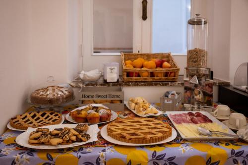 a table with many different types of food on it at Hotel Elios Tao in Taormina
