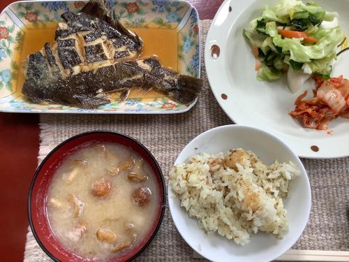 a table with three plates of food and rice at Sapporoの実家 B&B Yoshida in Sapporo