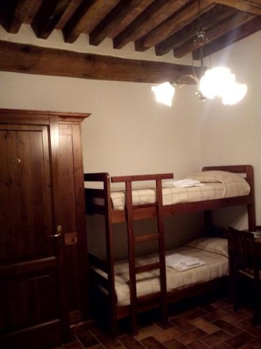 Ένα ή περισσότερα κρεβάτια σε δωμάτιο στο Agriturismo La Crocetta