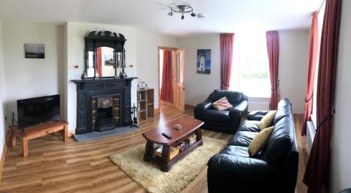 Posezení v ubytování Joes Cottage