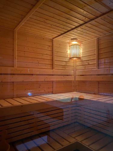 a wooden sauna with a light in the middle at Casa Cecilia Hotel in Bantay