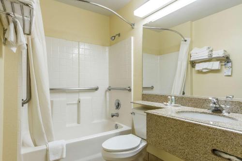 a bathroom with a sink and a toilet and a tub at Quality Inn & Suites in Santa Rosa