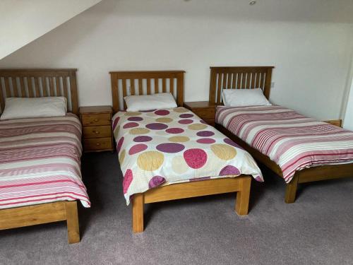 A bed or beds in a room at Radharc Na Ceibhe B&B H91 V0Y3