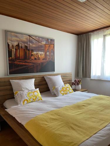 a bedroom with a large bed with a yellow blanket at Hotel Ochsen in Sankt Margrethen