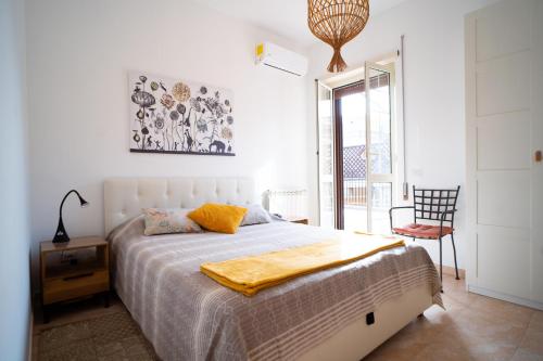 Postel nebo postele na pokoji v ubytování Attico Via Capo Soprano