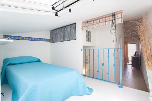 En eller flere senge i et værelse på Porto Coda Cavallo Beach House a 300 mt dal mare, con terrazza panoramica