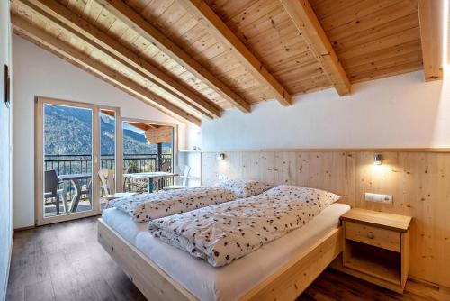 Postel nebo postele na pokoji v ubytování Thusnelda Apartment A