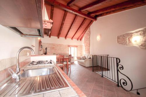 a kitchen with a sink and a stove at Casa Ijana in Novigrad Istria