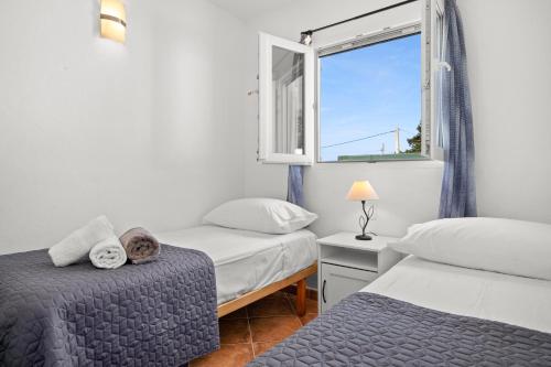 A bed or beds in a room at VILLA XOROI