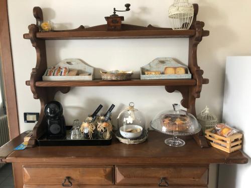 a shelf with food and other items on it at Da Scilla in Punta Marina