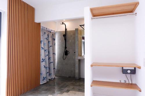 a bathroom with a shower with a shower curtain at Swiss House 5 in Pattaya South