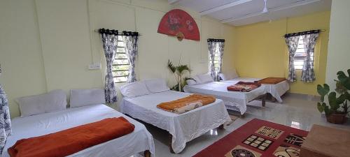 A bed or beds in a room at Coorg Coffee Park Farmstay