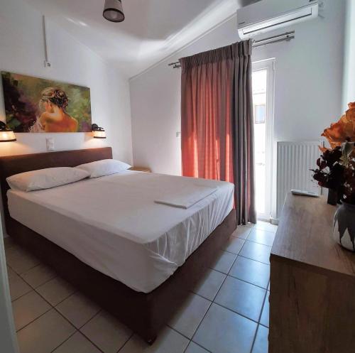 Postel nebo postele na pokoji v ubytování Ionian Apartment, Sami