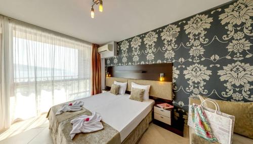 Postel nebo postele na pokoji v ubytování Briz Beach Apartments
