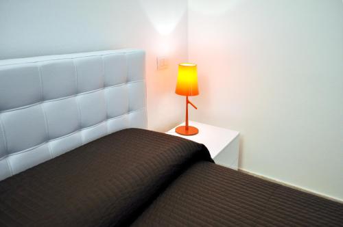 Letto o letti in una camera di BB Hotels Aparthotel Bocconi