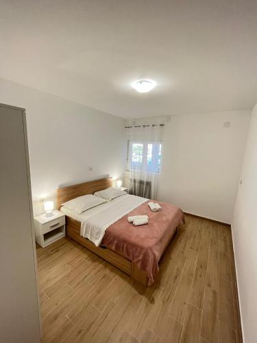 Ένα ή περισσότερα κρεβάτια σε δωμάτιο στο Apartman Maša